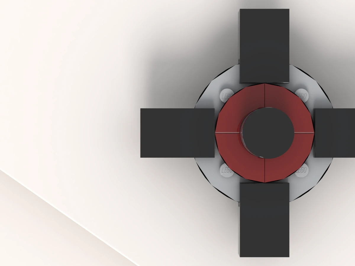 The fidget spinner at rest on its turntable, arm 1 facing you