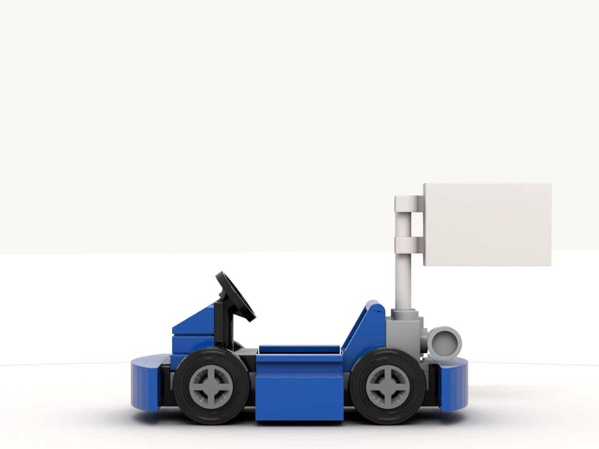 The go-kart model at rest on its turntable, flag facing you