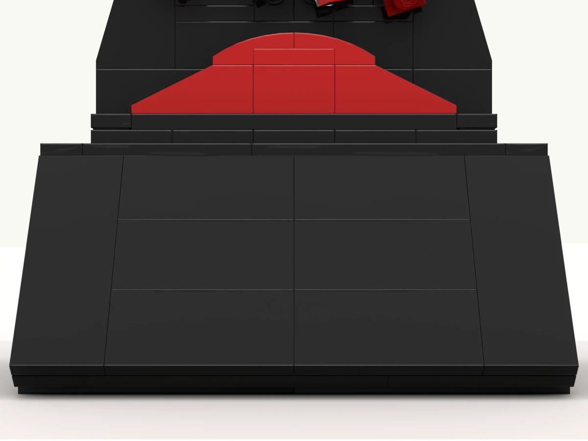 The sandglass deal toy at rest on its turntable, front facing you