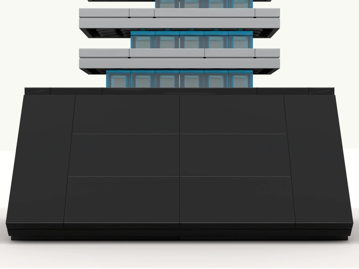 The skyscraper deal toy at rest on its turntable, front facing you
