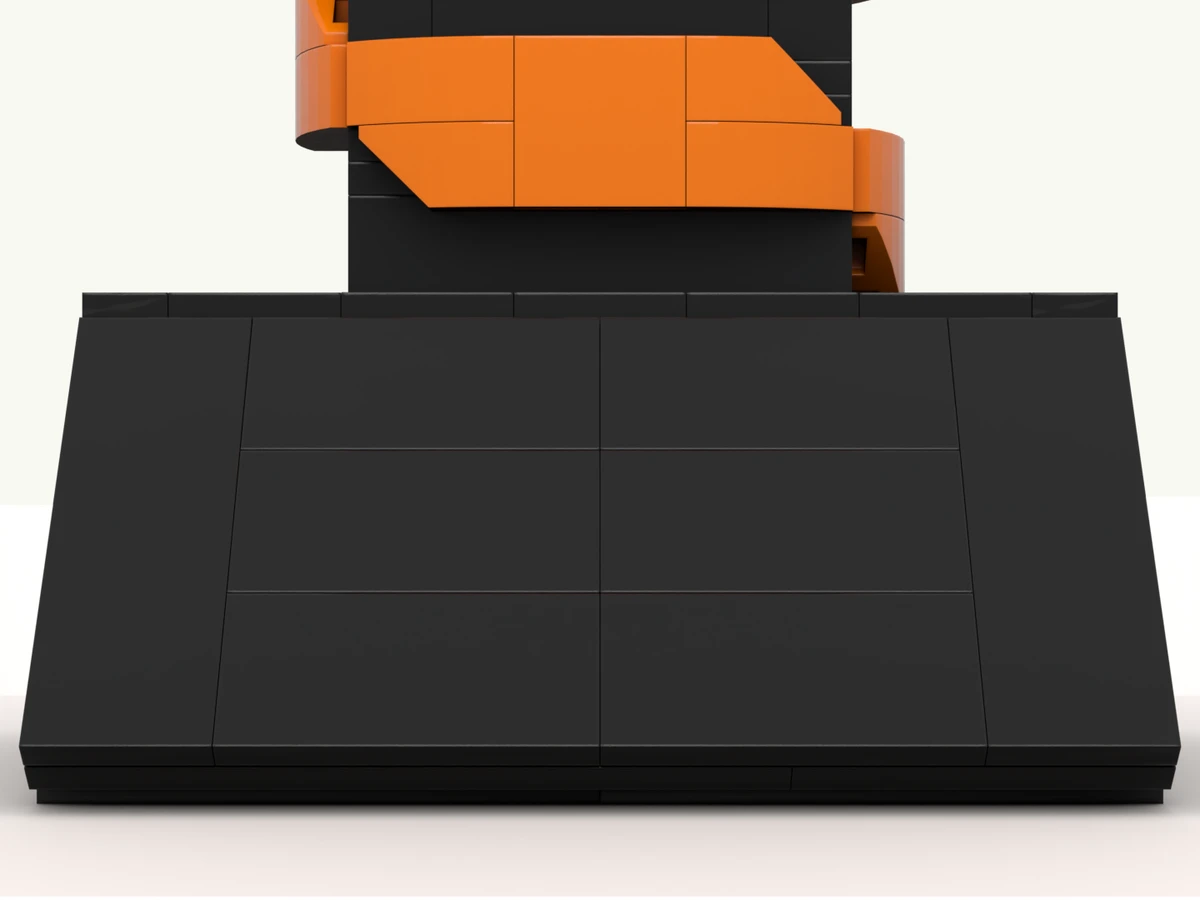 The snake deal toy at rest on its turntable, front facing you