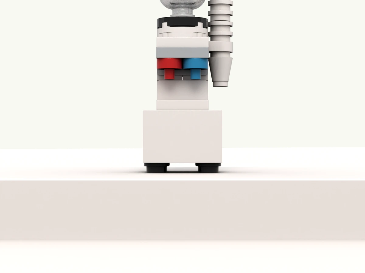 The water cooler model at rest on its turntable, front facing you