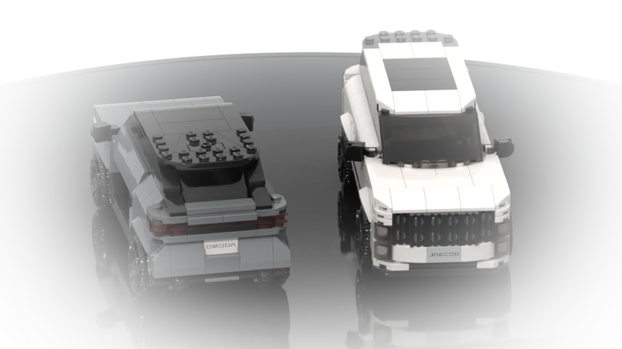 Two commissioned cars side by side, one gray and one white, built from LEGO® bricks.