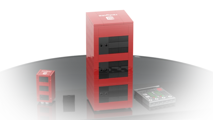 A commissioned red server cabinet with its smaller version and accessories beside it, built from LEGO® bricks.